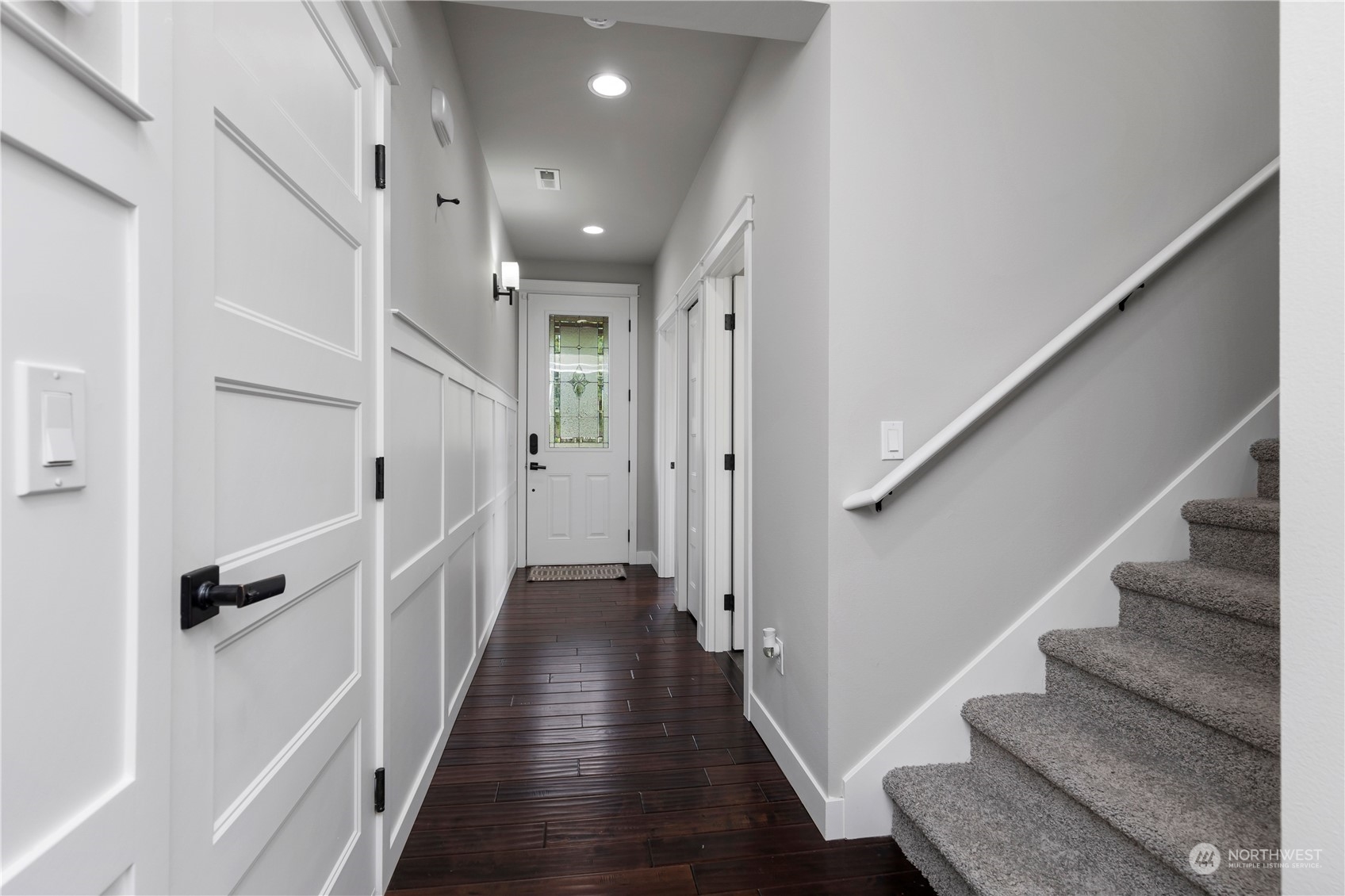 19730 Filbert Drive Bothell, WA 98012 - Photo 4 of 35 a view of a hallway with wooden floor and staircase