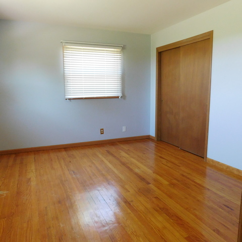 10471 Lee Road Waterman, IL 60556 - Photo 12 of 20 a view of an empty room with wooden floor and a window