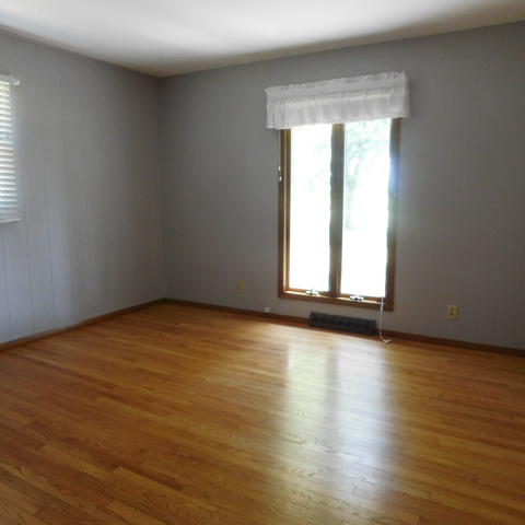 10471 Lee Road Waterman, IL 60556 - Photo 14 of 20 an empty room with wooden floor and windows
