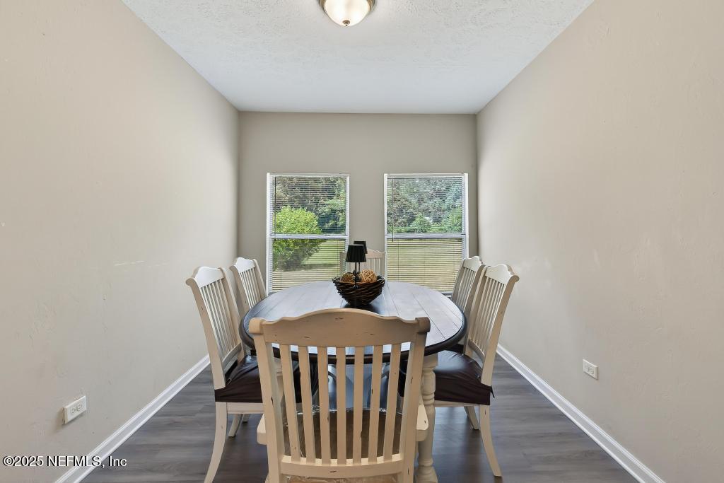 17080 Mcintosh Road Hilliard, FL 32046 - Photo 20 of 52 a view of a dining room with furniture window and wooden floor