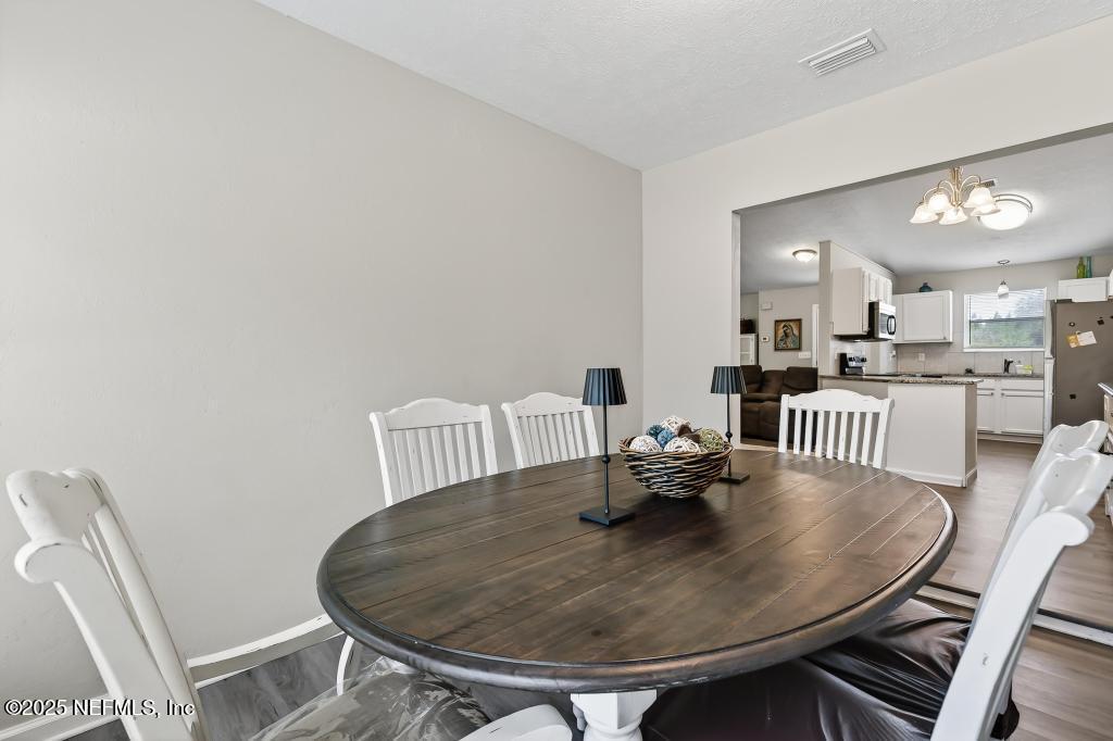 17080 Mcintosh Road Hilliard, FL 32046 - Photo 21 of 52 a dining room with furniture and window
