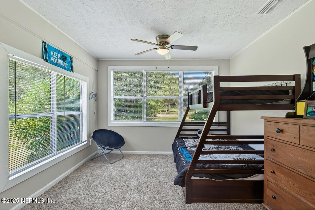 17080 Mcintosh Road Hilliard, FL 32046 - Photo 29 of 52 a view of entryway and hall with wooden floor
