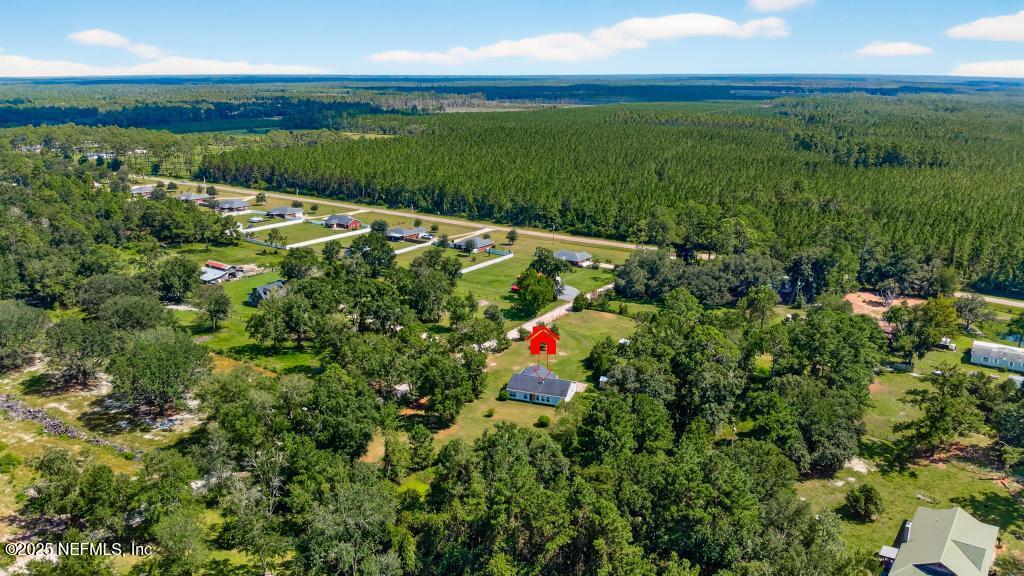 17080 Mcintosh Road Hilliard, FL 32046 - Photo 47 of 52 a view of a lake with a yard