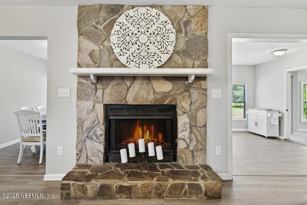 17080 Mcintosh Road Hilliard, FL 32046 - Photo 10 of 52 a living room with a fireplace