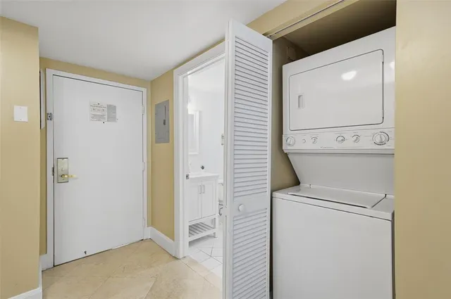 a living room with furniture and a piano