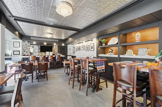 a view of backyard with sitting area