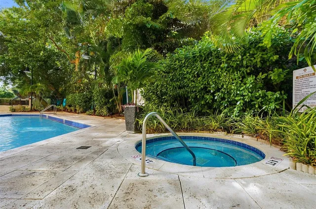 outdoor view with swimming pool and sitting area