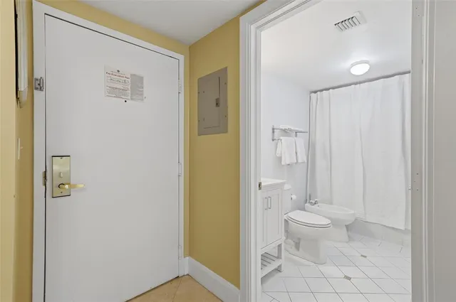 a view of bathroom with a washer and dryer