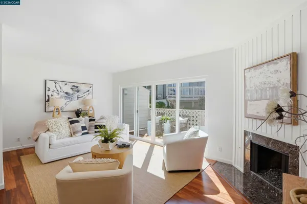 a kitchen with stainless steel appliances white cabinets and a stove top oven