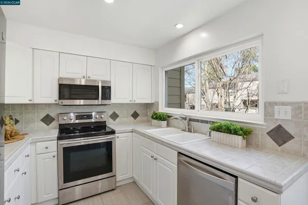 a bathroom with a sink mirror and toilet