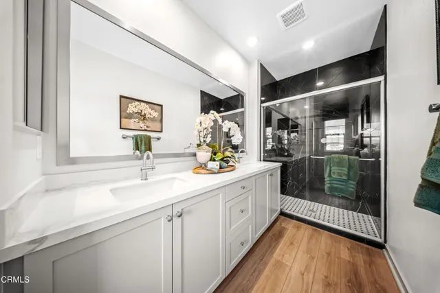 a bathroom with a sink and a mirror