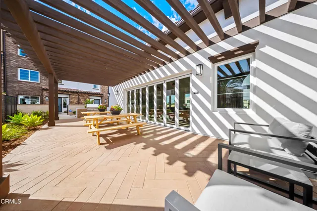 a view of a backyard with sitting area