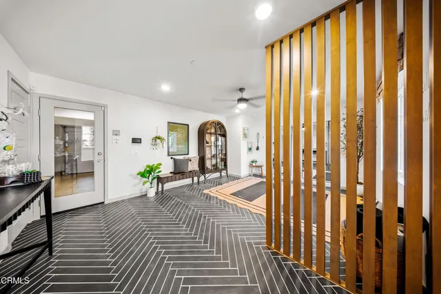 a bedroom with furniture and a window