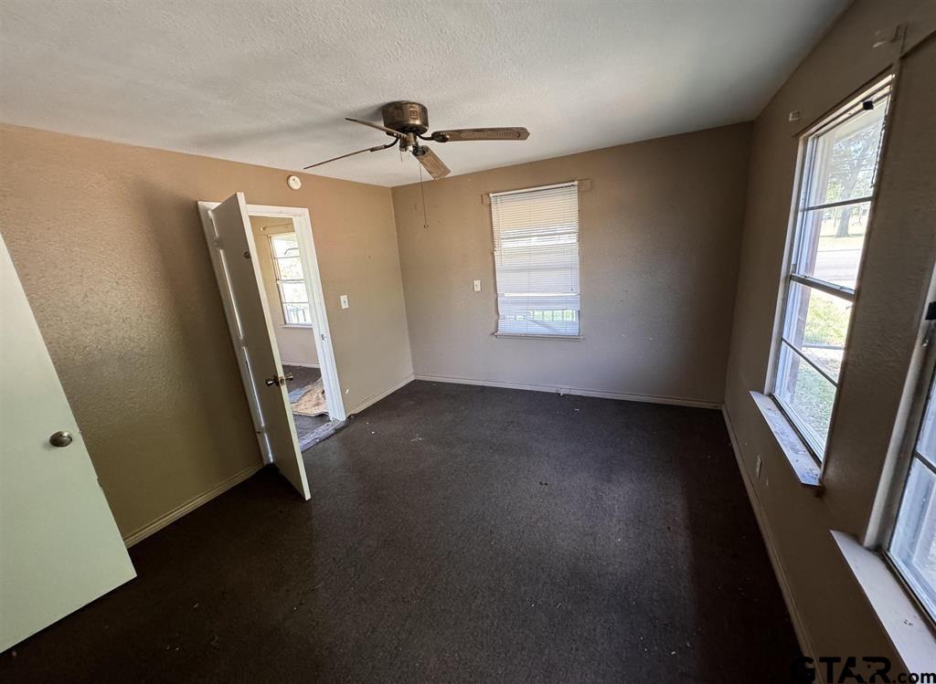 582 East Main Street Van, TX 75790 - Photo 11 of 12 a view of empty room with wooden floor and fan