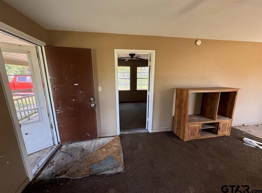 582 East Main Street Van, TX 75790 - Photo 12 of 12 a bedroom with a bed and wooden floor