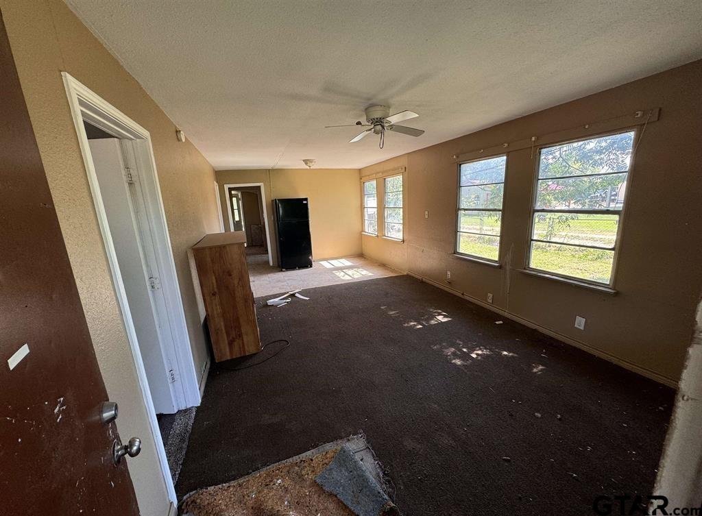 582 East Main Street Van, TX 75790 - Photo 9 of 12 a view of a livingroom with a furniture wooden floor and a window