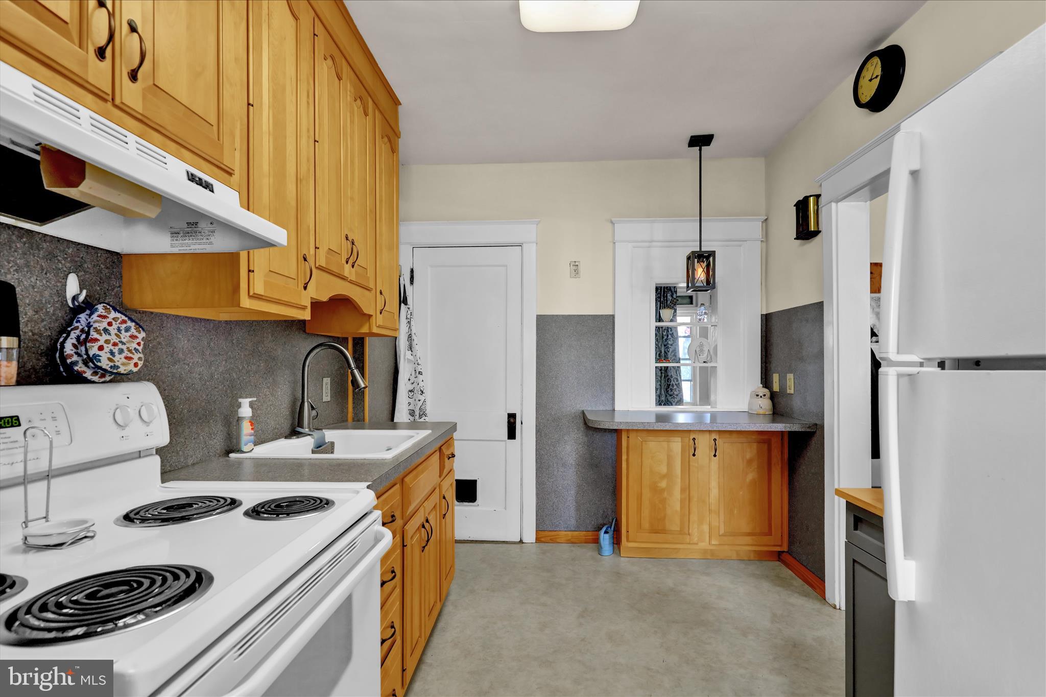 43 East Walnut Street Ephrata, PA 17522 - Photo 13 of 32 a kitchen with a stove a refrigerator and a stove