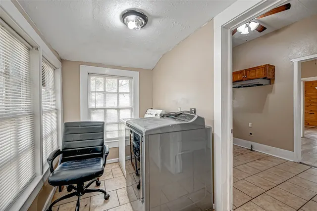 a view of workspace with furniture and windows