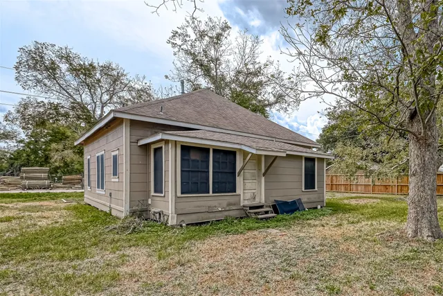 a house with trees in the background