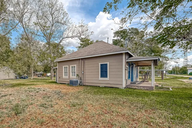 a front view of house with a garden