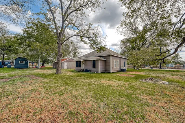 a large tree in front of a house
