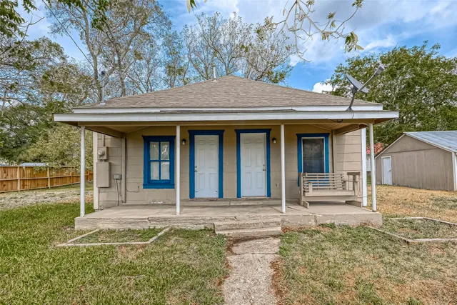 a house with trees in the background