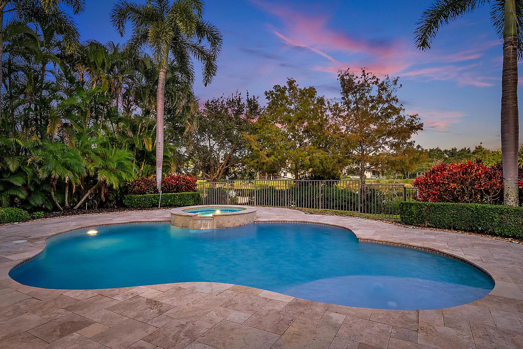 160 Umbrella Place Jupiter, FL 33458 - Photo 6 of 24 a view of a swimming pool with an outdoor space and seating area
