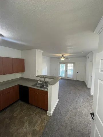 a view of a livingroom with a ceiling fan