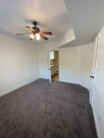 a bathroom with a granite countertop sink a large mirror and shower