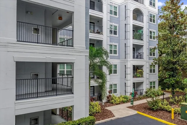 a kitchen with stainless steel appliances granite countertop a refrigerator and a stove