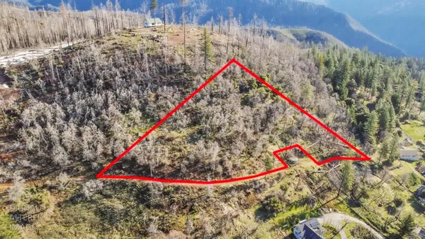 a view of swimming pool with red and white wooden fence