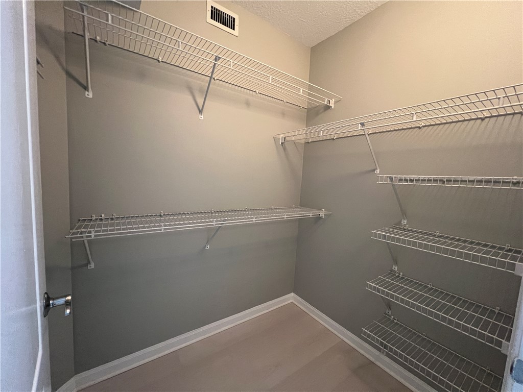 5090 Fairways Circle, Unit H308 Vero Beach, FL 32967 - Photo 11 of 19 a view of a room with racks on the wall
