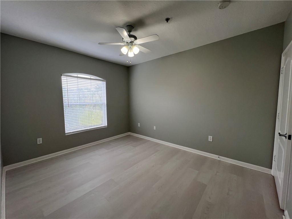 5090 Fairways Circle, Unit H308 Vero Beach, FL 32967 - Photo 13 of 19 a view of an empty room with a window