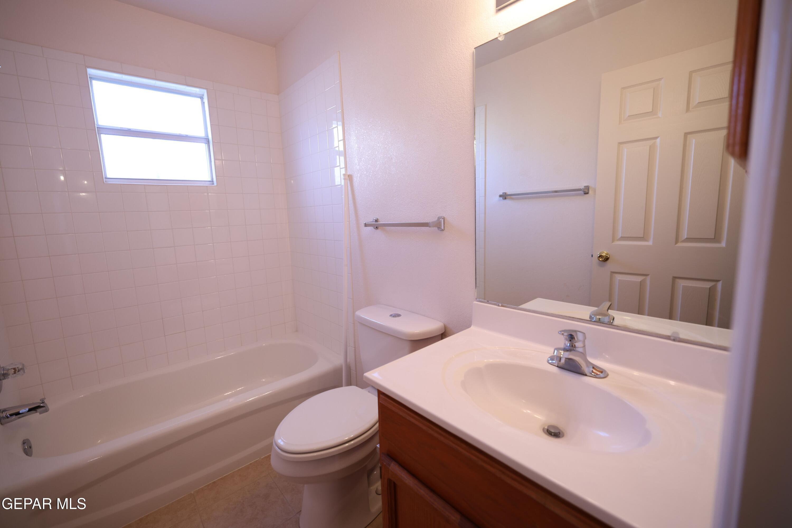 2210 Radford Street El Paso, TX 79903 - Photo 16 of 24 a bathroom with a sink toilet tub and shower