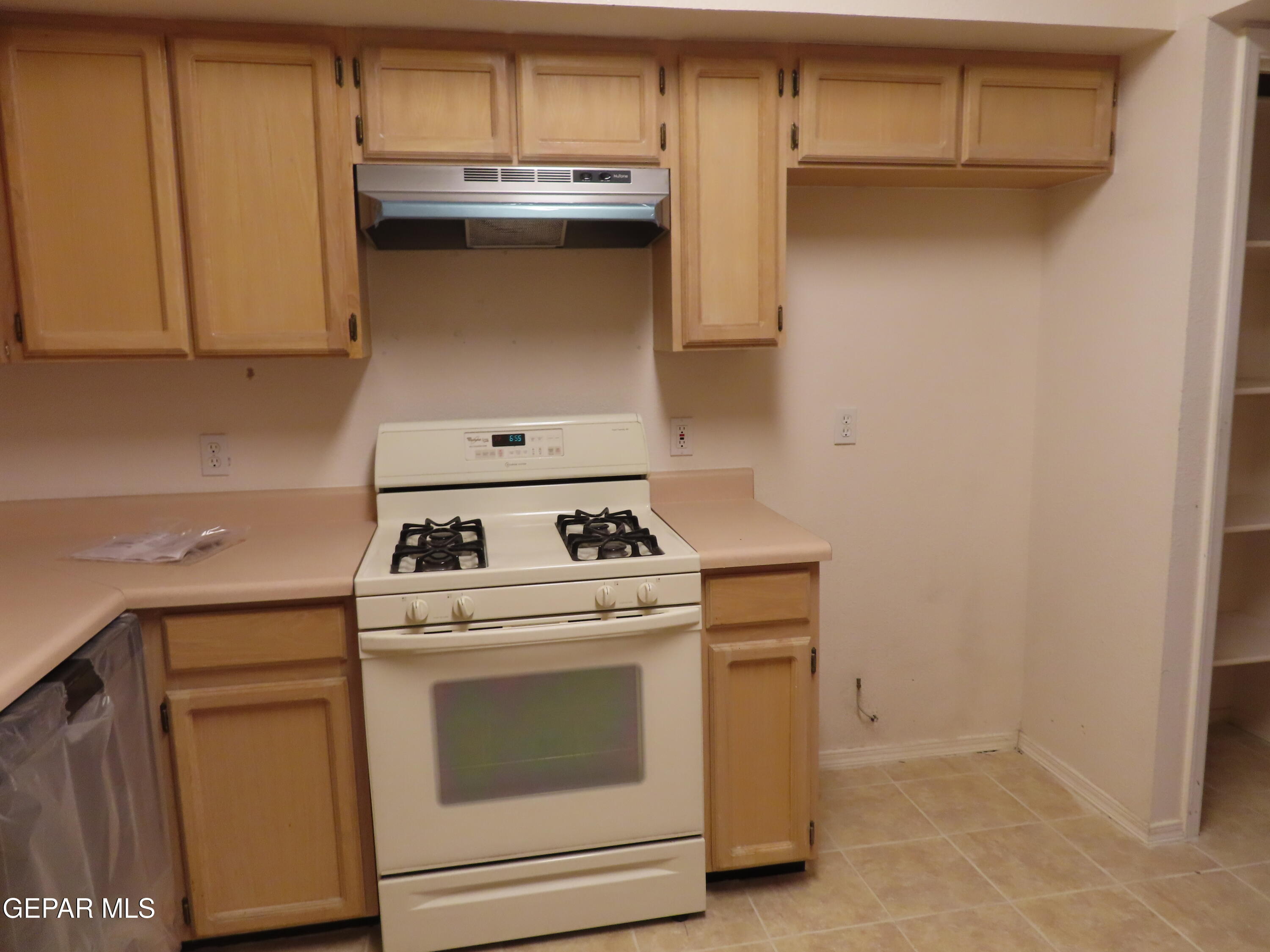2210 Radford Street El Paso, TX 79903 - Photo 23 of 24 a kitchen with a stove and a microwave