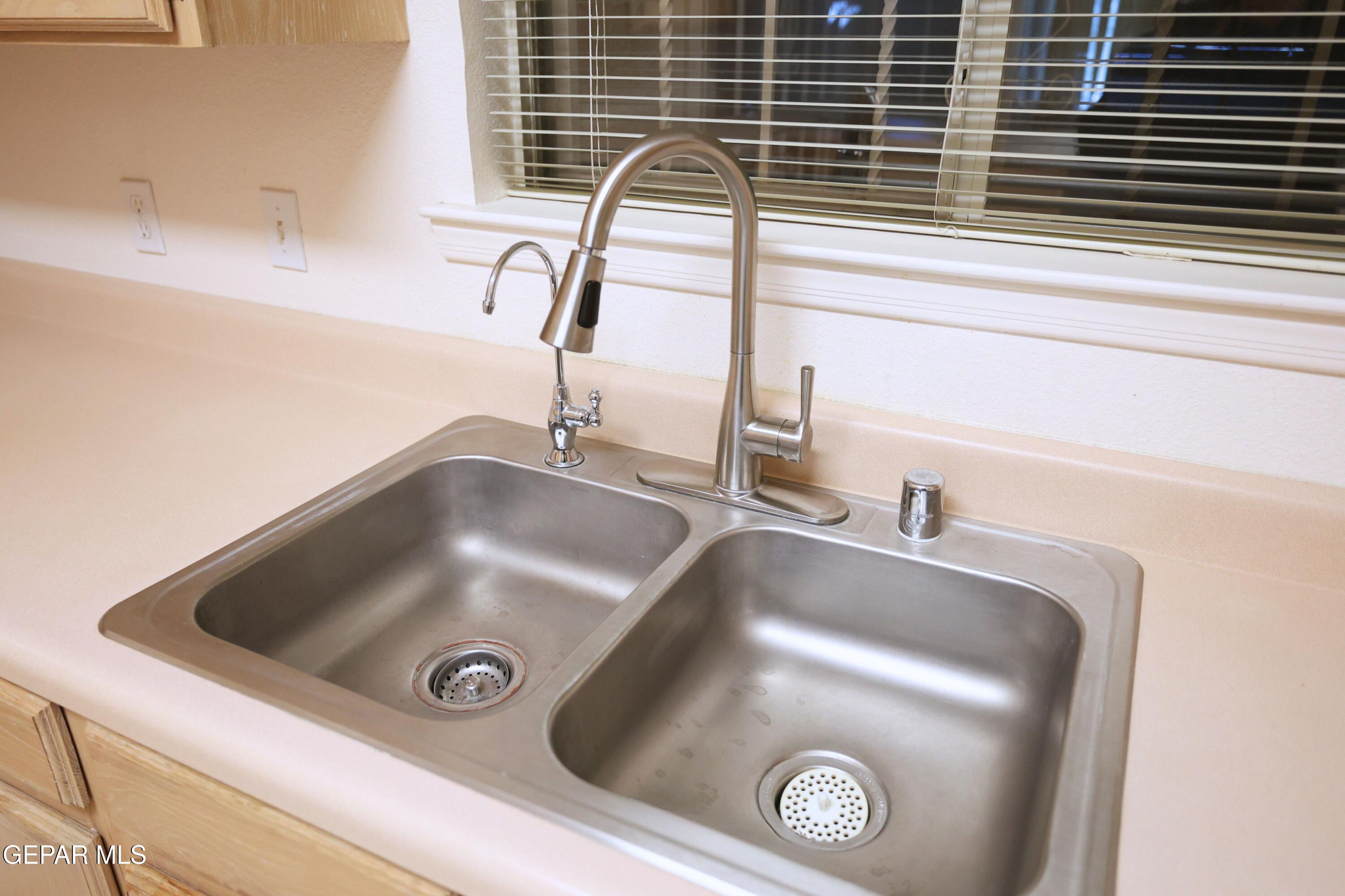 2210 Radford Street El Paso, TX 79903 - Photo 6 of 24 a close view of sink and a faucet washer and dryer