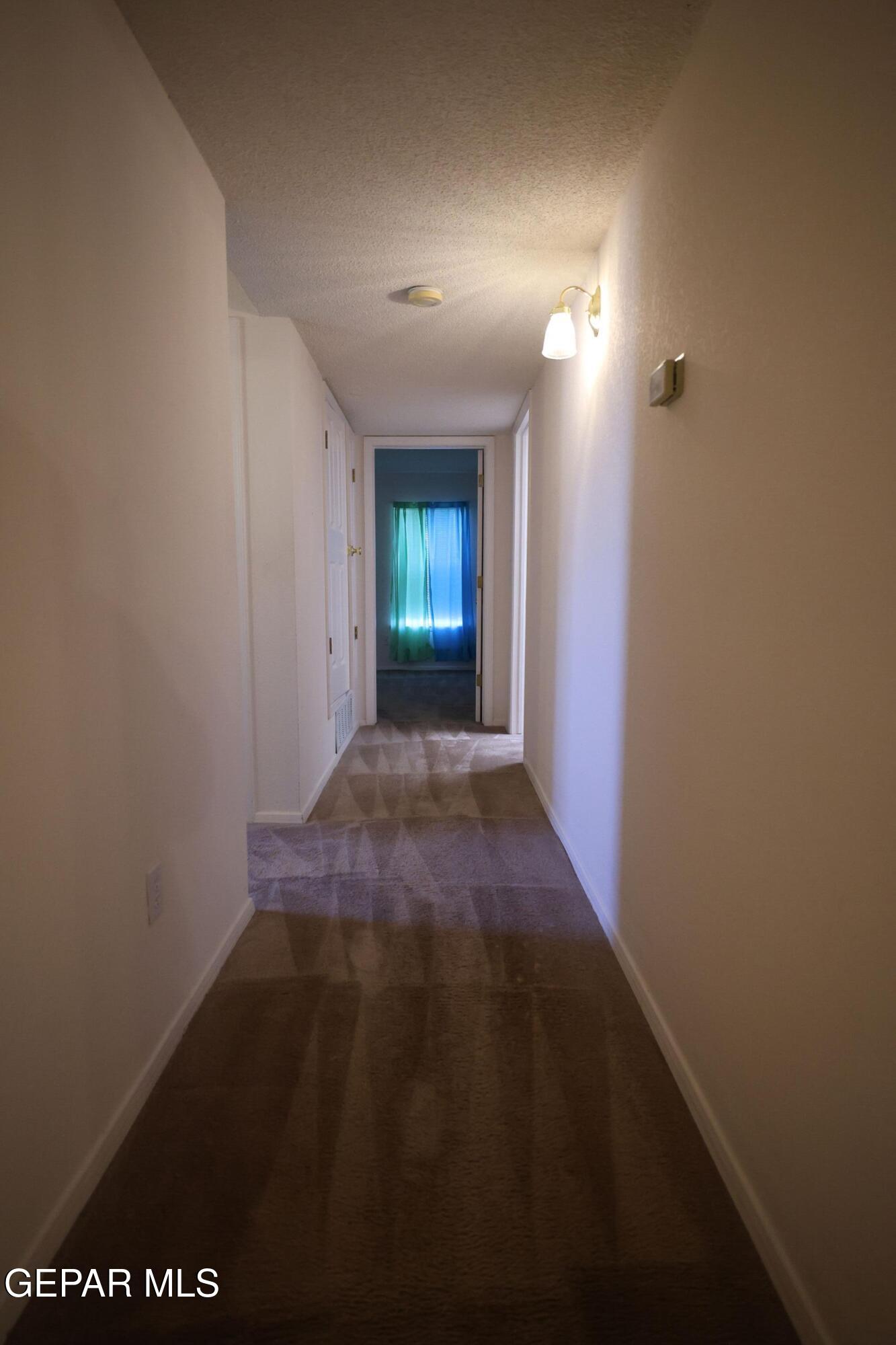 2210 Radford Street El Paso, TX 79903 - Photo 8 of 24 a view of a room with wooden floor and windows