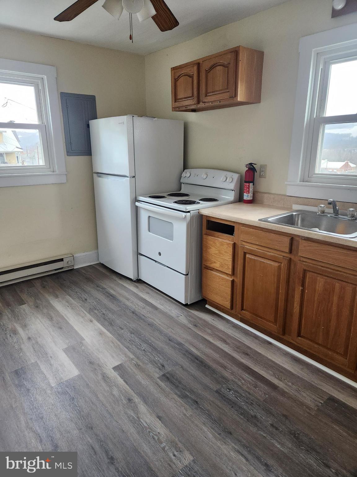 122 Spring Street, Unit B Keyser, WV 26726 - Photo 3 of 8 a kitchen with a cabinets and wooden floor