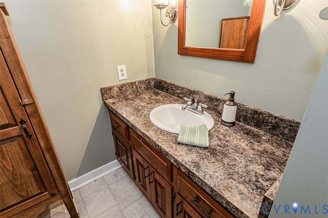 7300 Old Roxbury Road Quinton, VA 23141 - Photo 63 of 89 Wood-finish vanity with an integrated sink and chr
