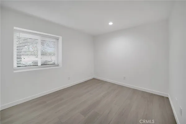 a bathroom with a toilet a sink and a mirror