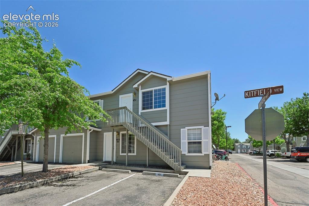 431 Kitfield View Colorado Springs, CO 80916 - Photo 2 of 27 a front view of a house with yard and trees