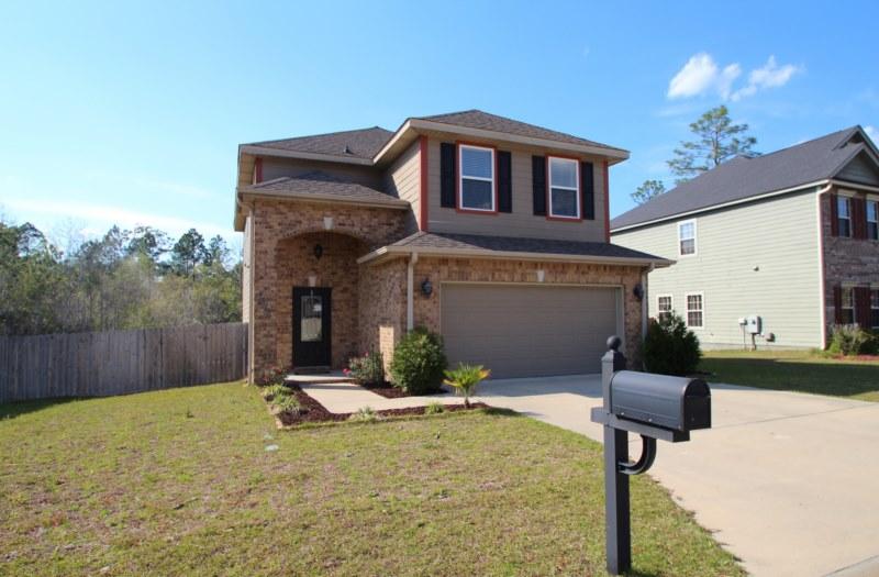4556 Hermosa Road Crestview, FL 32539 - Photo 1 of 35 a front view of a house with yard