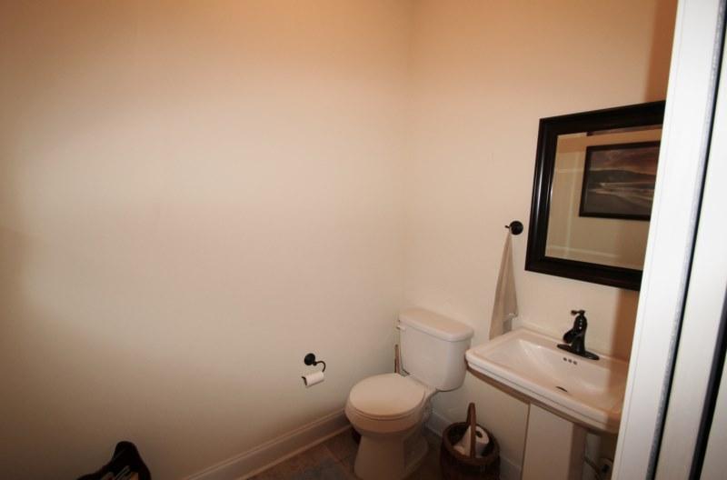 4556 Hermosa Road Crestview, FL 32539 - Photo 19 of 35 a bathroom with a sink toilet and mirror
