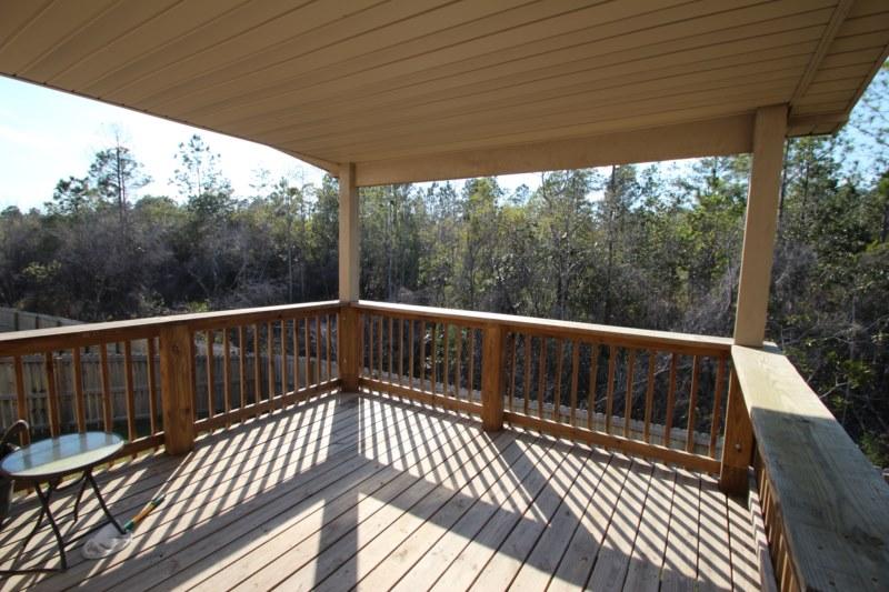 4556 Hermosa Road Crestview, FL 32539 - Photo 20 of 35 a view of a two chairs in the roof deck
