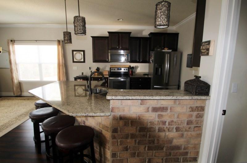 4556 Hermosa Road Crestview, FL 32539 - Photo 3 of 35 a kitchen with a dining table cabinets and appliances