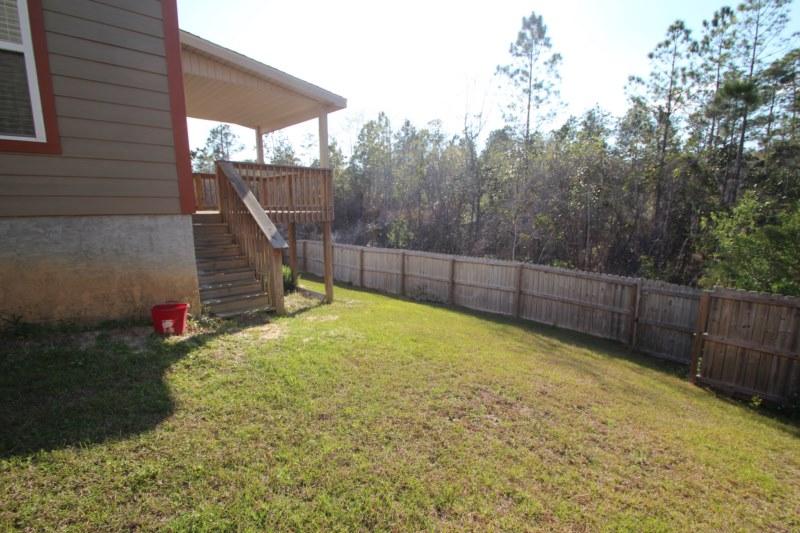 4556 Hermosa Road Crestview, FL 32539 - Photo 21 of 35 a view of a backyard