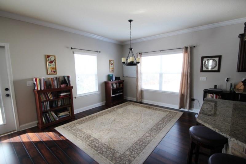 4556 Hermosa Road Crestview, FL 32539 - Photo 24 of 35 a living room with furniture and a flat screen tv