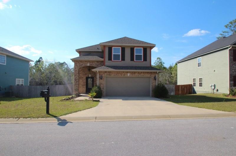 4556 Hermosa Road Crestview, FL 32539 - Photo 25 of 35 a front view of a house with a yard