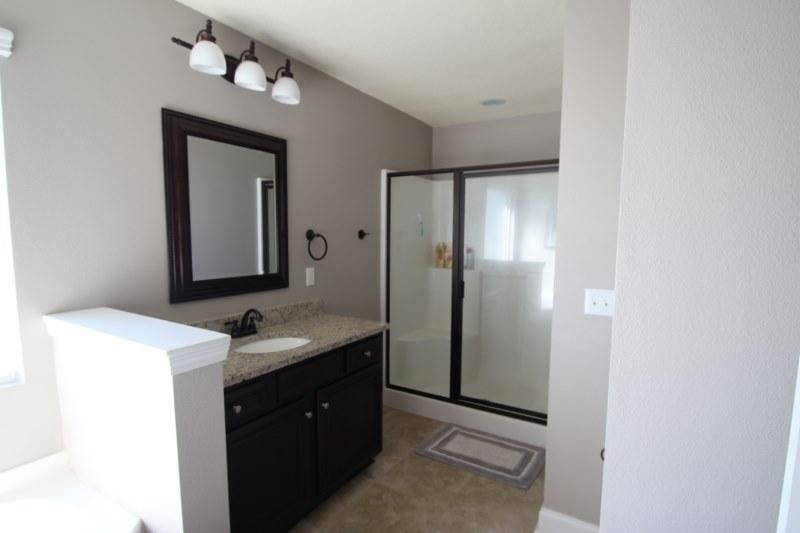 4556 Hermosa Road Crestview, FL 32539 - Photo 26 of 35 a bathroom with a sink a mirror and a vanity