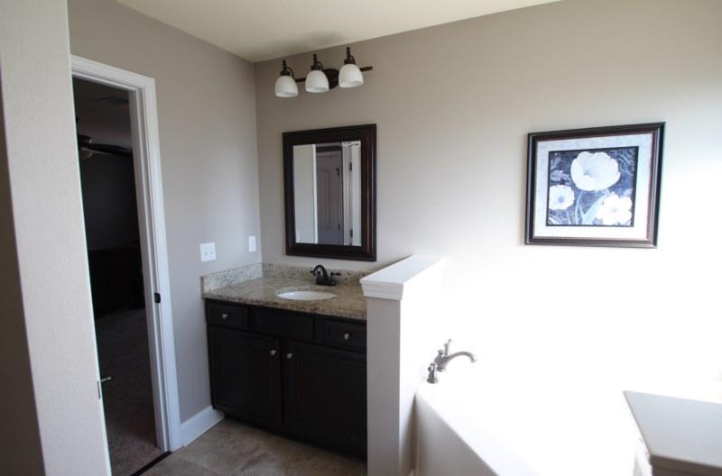 4556 Hermosa Road Crestview, FL 32539 - Photo 27 of 35 a bathroom with a toilet sink and mirror